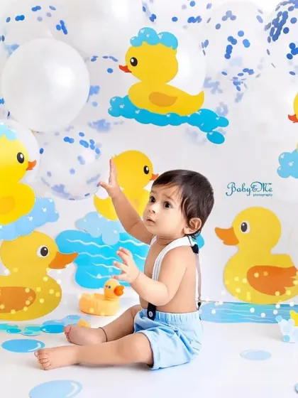 Reaching for the bubbles! The ducky theme is full of interactive elements that lead to adorable, candid moments like this.