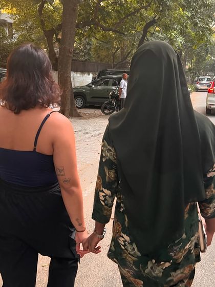 We meet as strangers and leave as friends. Two members of our community walking hand-in-hand after a day of creating and connecting.