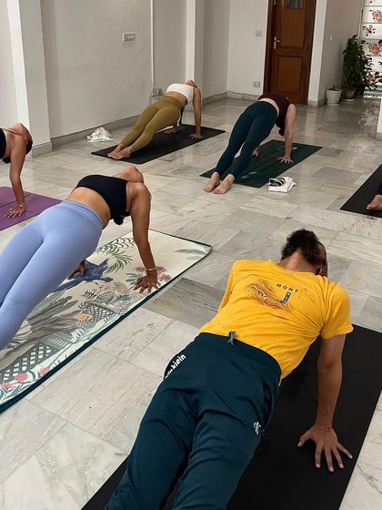 Holding a strong Purvottanasana (Upward Plank Pose) in our group class. Each practice is a step toward discovering the power within.