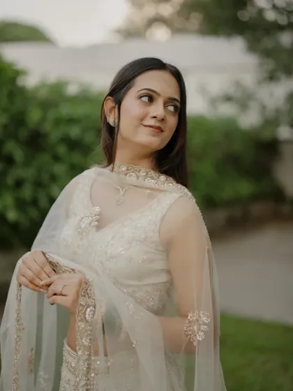 A thoughtful portrait of the bride-to-be, her natural beauty enhanced by minimal makeup.