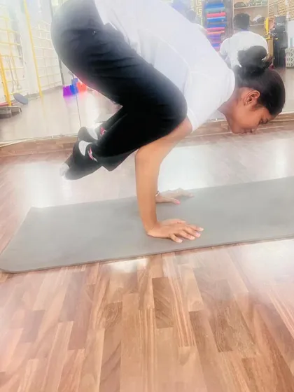 Building arm strength with Bakasana, the crow pose. This is often the first arm balance yogis learn, and it's a huge confidence booster.