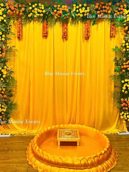 The same beautiful marigold Haldi setup, shown from a straight-on angle.
