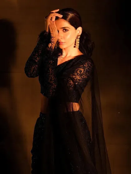 A full look from the moody Nayantaara campaign. The makeup is intentionally understated to complement the intricate black-on-black embroidery and maintain a sophisticated, high-fashion aesthetic.