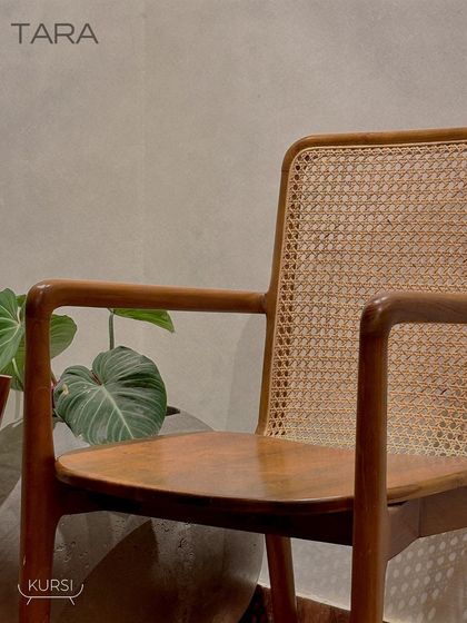 The 'Tara' armchair in a client's home, adding a touch of natural elegance to their living space. The simple lines and natural materials are exceptionally comfortable.