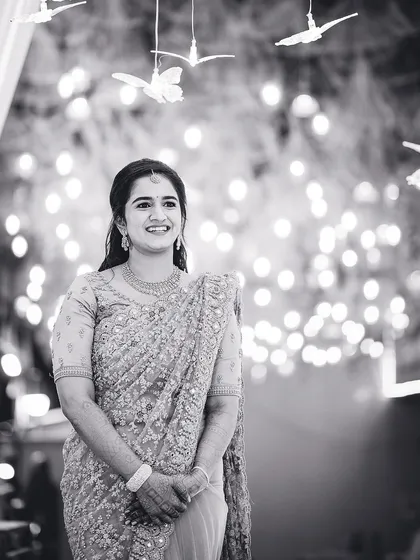 A beautiful, candid smile captured in a classic black and white portrait. We look for those natural expressions that reveal the true personality of our subjects during any event.