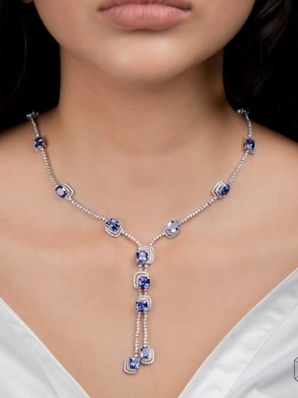 This stunning tanzanite and diamond necklace guarantees authenticity and value, offering peace of mind with its beauty.
