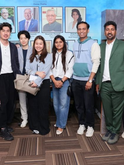 A group of international visitors at the 'Ethereal Charm' exhibition, showing the global appeal of our curated art.