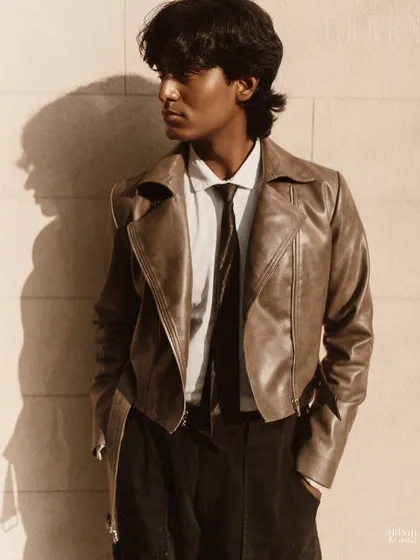 This shot captures the styled mullet and clean skin from a different angle. The goal for this men's grooming look was to appear effortlessly cool and polished, suitable for a fashion lookbook or campaign.
