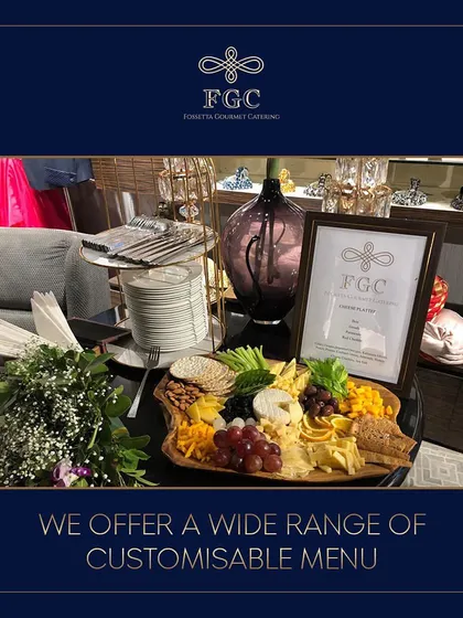We offer a wide range of customizable menus and presentations. A beautifully arranged cheese and fruit board serves as a centerpiece at this station, showcasing our versatile offerings.