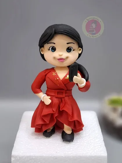 The beautiful Bharti Singh in fondant form, complete with her red dress and microphone. It's an honor to create art that celebrates such beloved personalities.