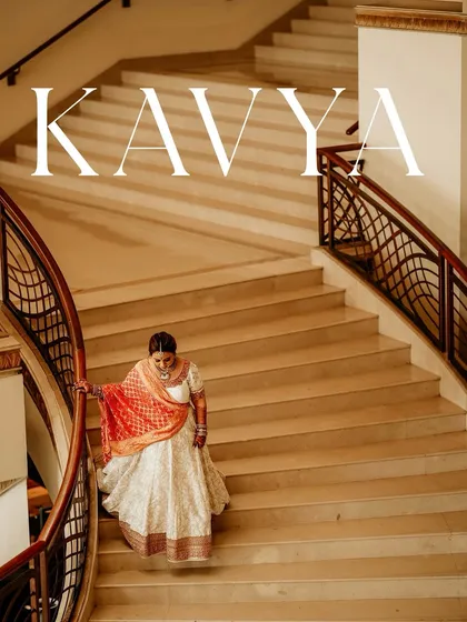A bride descending a grand staircase, the picture of elegance. This shot uses the architectural lines and her graceful movement to create a stunning and classic bridal portrait.