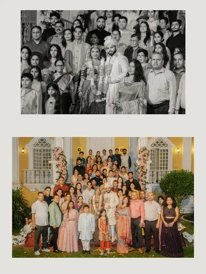 A formal group portrait of the couple with their family and friends, a timeless keepsake from their destination wedding in Goa.