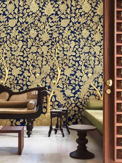 This is the kind of grandeur we bring to your walls. A design from our Prakriti collection, featuring the traditional Tree of Life motif in stunning gold on a deep blue base, creating a truly royal and welcoming atmosphere in this living space.