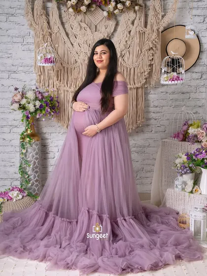 A classic full-length portrait in our lavender tulle gown, set against a rustic white brick and macrame backdrop.