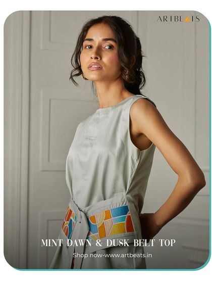 The Mint Dawn & Dusk Belt Top. The belt on this top is a canvas for my colorful, geometric artwork, allowing you to cinch your waist with a piece of art.