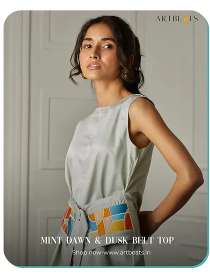 The Mint Dawn & Dusk Belt Top. The belt on this top is a canvas for my colorful, geometric artwork, allowing you to cinch your waist with a piece of art.