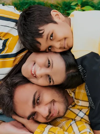 Family photos should be fun, not formal. I love capturing genuine connection, like this playful family stack, which shows their unique bond and happy energy during our outdoor session.