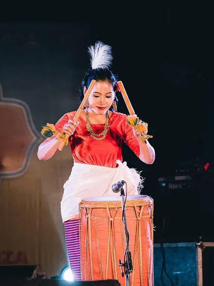 A talented artist from the band Rhythms of Manipur performs with passion on the drums. This photo highlights the vibrant energy and unique traditions I get to capture at cultural events around Delhi.