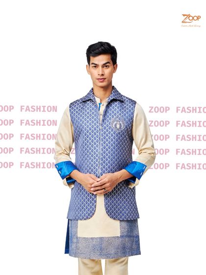 A thoughtful blend of sophistication and comfort. This layered look, featuring a blue patterned zip-up vest over a cream kurta, is a versatile option for any discerning gentleman.