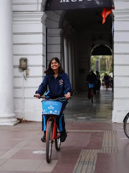 A young rider enjoys a smooth ride through the corridors of Connaught Place. Our tours are a hit with people of all ages.