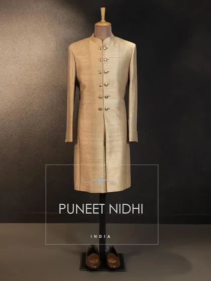 An antique color Matka Silk double-button Achkan. A simple yet powerful statement of heritage and style.