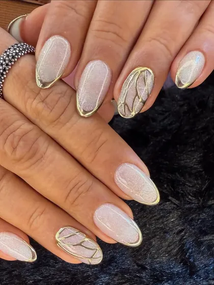 This elegant design features a shimmery white base with delicate gold chrome outlines. An accent nail with a butterfly wing pattern adds a touch of artistic flair.