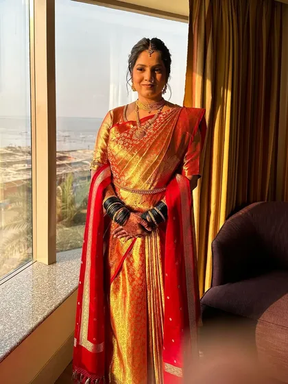 A full-length shot of a beautiful South Indian bride. I styled her hair and draped her stunning silk saree to perfection.