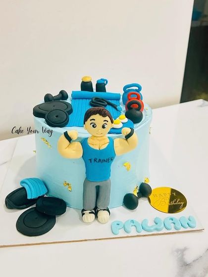 Flexing into another year with this gym-themed cake, complete with a fondant trainer and weights.