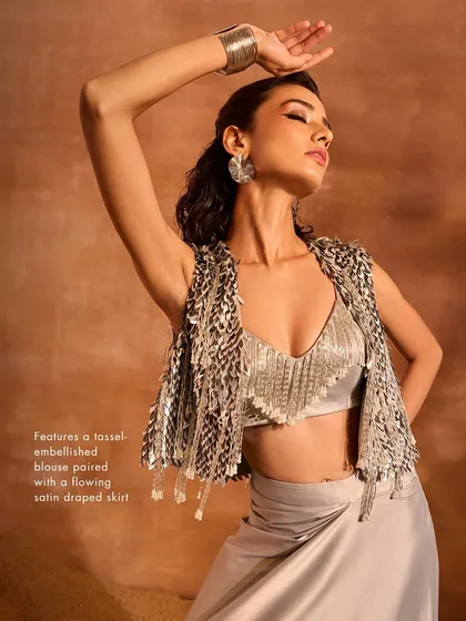A close-up of the Blaze Co-ord Set, featuring a tassel-embellished blouse and jacket paired with a flowing satin draped skirt for a luxurious feel.
