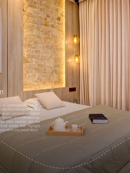 A bold and seamless bedroom design. This space uses texture and lighting to create a room that is both dramatic and comforting.