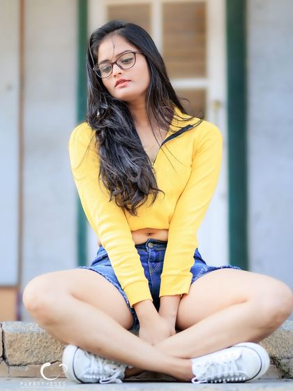 A pensive and thoughtful version of the seated pose. This shows how a simple change in expression can alter the mood of a portrait.