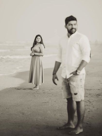 An artistic portrait using depth of field, with Milando in the foreground and Joann in the background. This composition adds a storytelling element to their gallery.