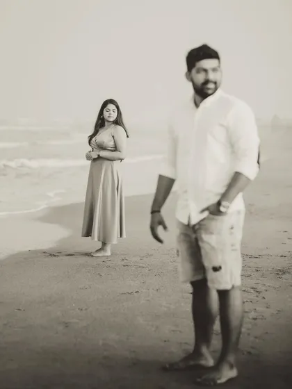 An artistic portrait using depth of field, with Milando in the foreground and Joann in the background. This composition adds a storytelling element to their gallery.