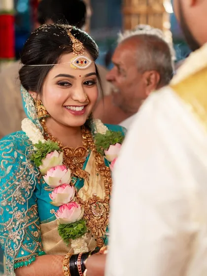 A candid moment from a wedding ceremony. My goal is to create makeup that not only looks beautiful in photos but also feels comfortable and stays perfect through every ritual.