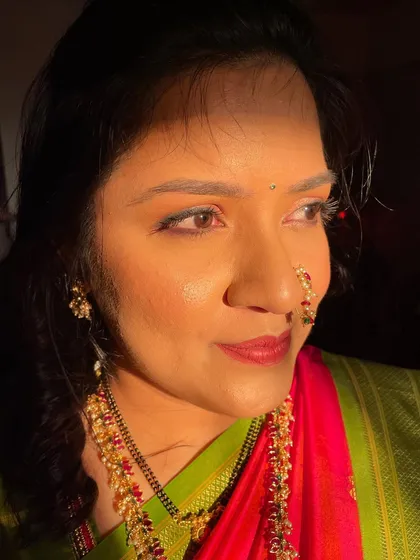 A beautiful profile of this guest, showcasing the soft, sun-kissed makeup look.