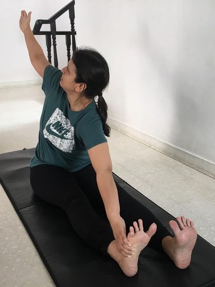 A preparatory pose for Parivrtta Paschimottanasana (Revolved Seated Forward Bend). The lateral twist stimulates blood circulation in the spine and can provide great relief from backaches.