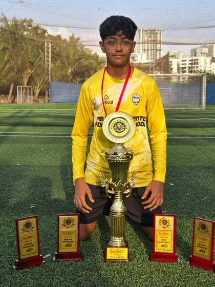 Our U15 goalkeeper with the championship trophy and his best goalkeeper award.