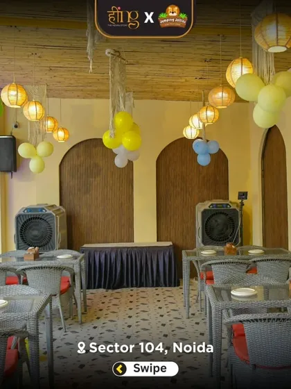 The outdoor covered dining area set up for a party. The space is versatile and can be arranged to accommodate buffet lines and guest seating for events of all sizes.