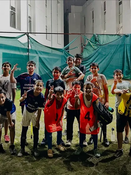 All smiles from our young wolves after a rainy day training session. This photo captures the joy and camaraderie that is a core part of our academy's culture.