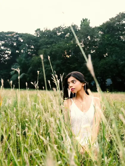 Peeking through the tall grass, this shot feels intimate and connected to the natural surroundings.