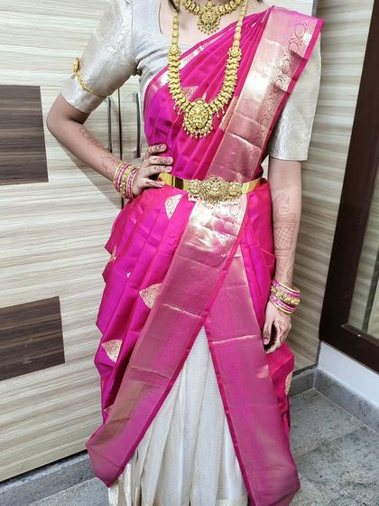 A confident pose in a butterfly drape. The style is bold and fashionable, perfect for someone who wants to stand out.