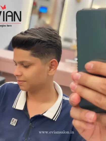 A young client getting a fresh new look. This image captures the moment of concentration as I perfect the details of his haircut.