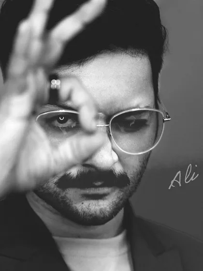 Working with talented actors like Ali Fazal is about capturing their personality. This black and white portrait uses focused lighting to create a sense of intimacy and intensity, highlighting his expression and drawing the viewer's eye directly to his.