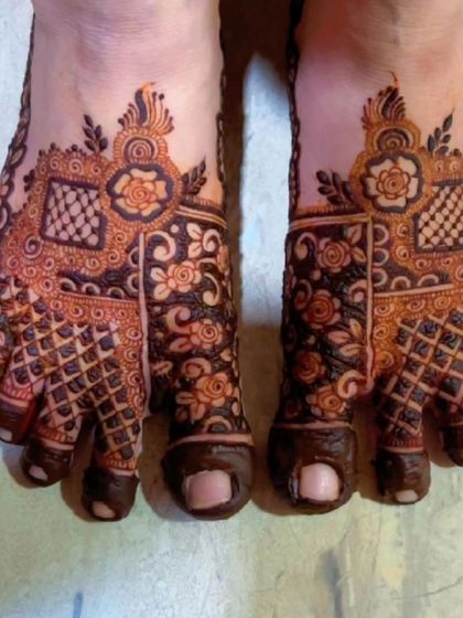 A unique foot design with a patchwork of different patterns, including florals and checkerboards.