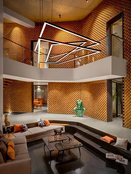 For the Sun House, we asked if a house could have emotions. The double-height living space, with its dramatic brick walls and sunken amphitheater seating, is our answer. It is a space designed to be powerful in its moods and imaginative in its form.