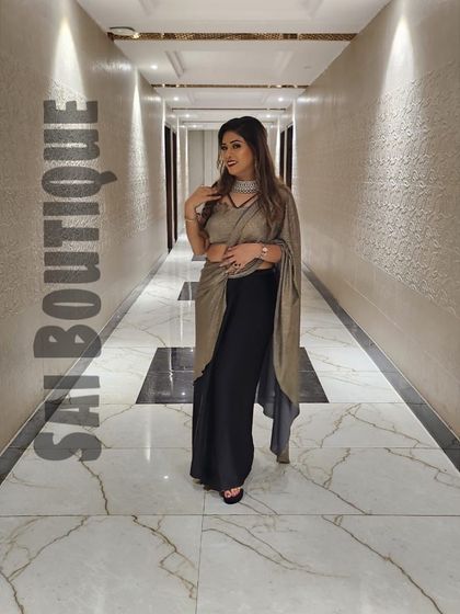 A full-length shot of the elegant two-tone drape saree, showing its unique and modern silhouette.