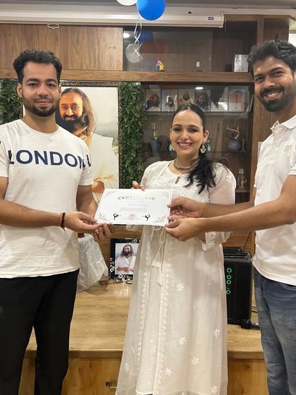 Another member of the "Yog Mitra" team is awarded his certificate. Our events are a testament to the strong community we've built.