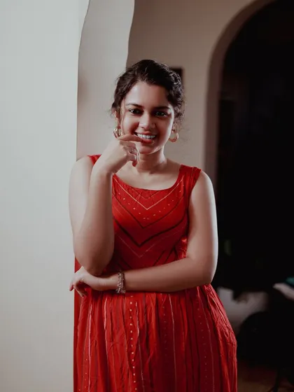 A playful and sweet expression. It's important to have a variety of emotions in a portfolio, and this shot adds a touch of lightheartedness.