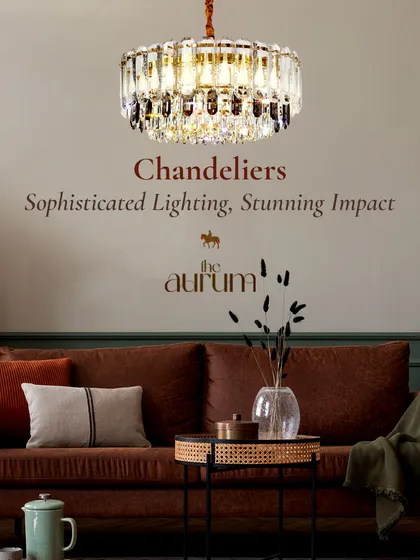 This crystal-encrusted drum chandelier adds a touch of glamour to a cozy living room. It’s a sophisticated piece that provides both ambient light and a stunning visual impact.