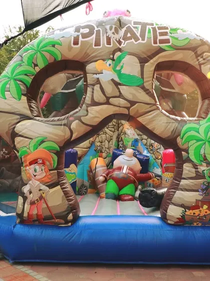 Bounce into adventure with this pirate-themed inflatable castle! I provide a wide range of large-scale bouncies and obstacle courses that become the centerpiece of any outdoor event, perfect for kids to burn off energy and have a blast.